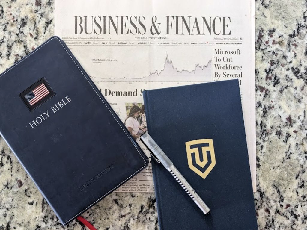 Business and Finance newspaper with Bible from TrueVine Family Wealth - a Christian financial advisor
